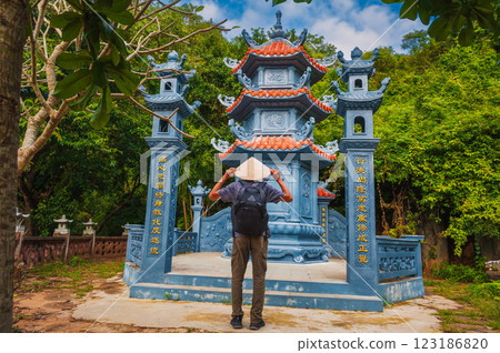 male tourist traveler at temple on Buddhist pagoda in Da Nang, Vietnam. Travel and tourism in Asia 123186820