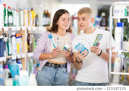 Couple man and woman choosing dental care products Couple man and woman choosing dental care products 123187135
