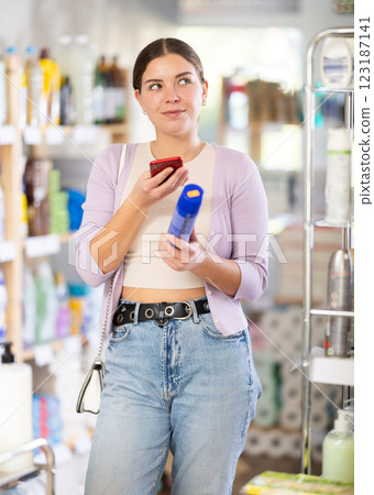 Young woman scanning qr code for aerosol 123187141