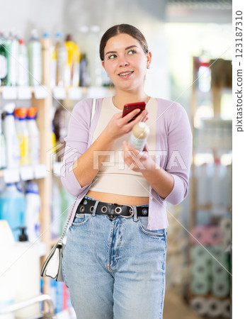 Young woman scanning qr code for aerosol Young woman scanning qr code for aerosol 123187310