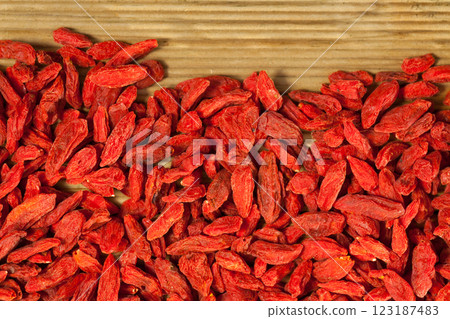 Dried Goji berries on wooden surface 123187483
