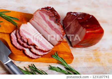 Piece of tasty smoked pork belly on wooden surface 123187741