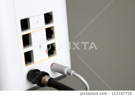 white router with internet cable connected 123187758