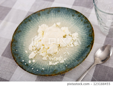 Cottage cheese served with sour cream Cottage cheese served with sour cream 123188455