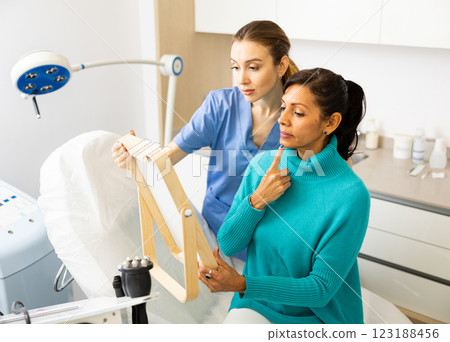 Woman having consultation at aesthetic medicine clinic Woman having consultation at aesthetic medicine clinic 123188456
