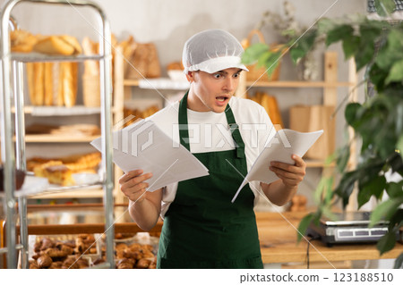 Upset bakery owner shocked by rising utility bills and taxes 123188510