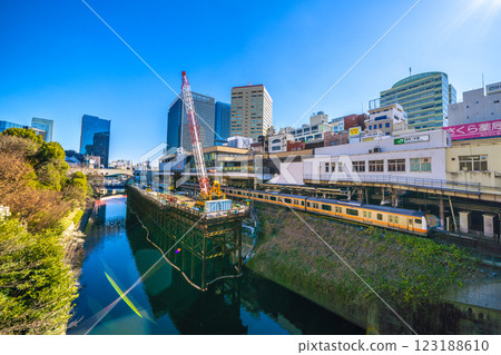 Tokyo cityscape in Japan. View of Ochanomizu Station from Ochanomizu Bridge. Hijiri Bridge in the background on the left (10th) Tokyo cityscape in Japan. View of Ochanomizu Station from Ochanomizu Bridge. Hijiri Bridge in the background on the left (10th) 123188610