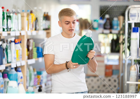 Male consumer with household chemical products for washing indoors 123188997