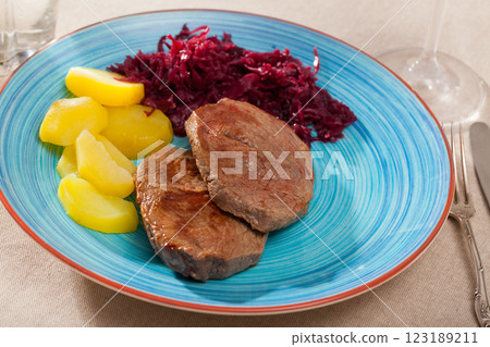 Veal steak with potato and sauerkraut 123189211