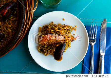 Seafood paella with shrimps and clams Seafood paella with shrimps and clams 123189423