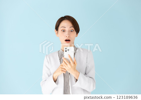 Woman business portrait smartphone surprised Woman business portrait smartphone surprised 123189636