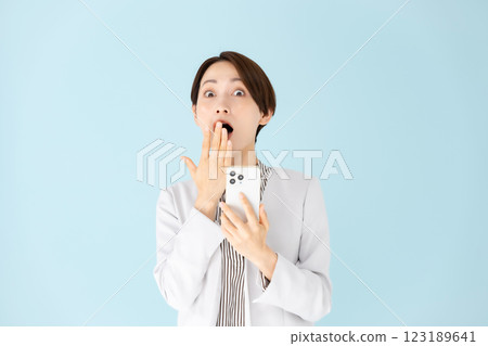 Woman business portrait smartphone surprised 123189641