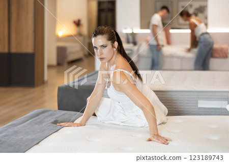 Adult woman chooses mattress in store 123189743