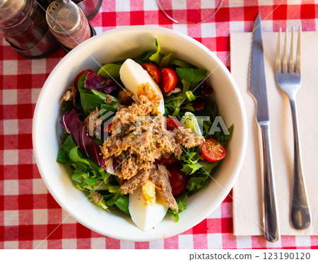 Salad with eggs, tuna and cherry tomatoes 123190120