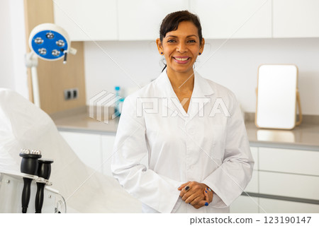 Latino american cosmetician welcoming to cosmetology clinic 123190147