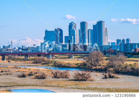 Tokyo cityscape in Japan on February 10th... View of the Tama River and tower apartment complexes in front of Kawasaki and Musashi-Kosugi stations = Reiwa 7 123190866