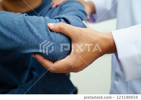 Physical therapy, Asian therapist doctor treat perform pain therapy in hospital. 123190919