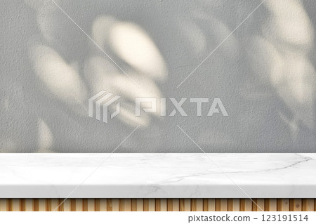 Empty Japandi Marble Table with Natural Light and Bokeh on Stucco Wall Texture Background Empty Japandi Marble Table with Natural Light and Bokeh on Stucco Wall Texture Background 123191514