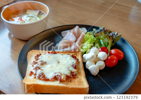 Breakfast plate with cheese toast and vegetable soup 123192379