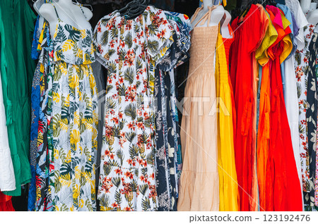 women's multicolored dresses at East Asian street market women's multicolored dresses at East Asian street market 123192476