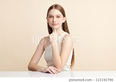 Beautiful young woman with clean fresh skin on beige background, Face care, Facial treatment, Cosmetology, beauty and spa, women portrait. 123192790