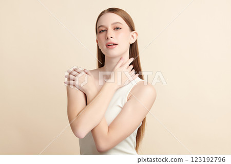 Beautiful young woman with clean fresh skin on beige background, Face care, Facial treatment, Cosmetology, beauty and spa, women portrait. Beautiful young woman with clean fresh skin on beige background, Face care, Facial treatment, Cosmetology, beauty and spa, women portrait. 123192796