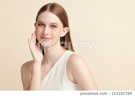 Beautiful young woman with clean fresh skin on beige background, Face care, Facial treatment, Cosmetology, beauty and spa, women portrait. Beautiful young woman with clean fresh skin on beige background, Face care, Facial treatment, Cosmetology, beauty and spa, women portrait. 123192799