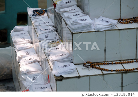 Religious objects are waiting for a blessing on the grave of Croatian missionaries, Jesuit father Ante Gabric in Kumrokhali, West Bengal, India Religious objects are waiting for a blessing on the grave of Croatian missionaries, Jesuit father Ante Gabric in Kumrokhali, West Bengal, India 123193014