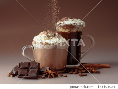 Hot chocolate and coffee with whipped cream sprinkled with chocolate crumbs. Hot chocolate and coffee with whipped cream sprinkled with chocolate crumbs. 123193084