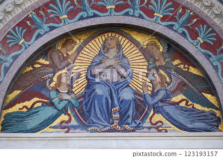 Virgin Mary, colourful mosaic by Giuseppe Modena da Lucca, above the middle door of Cathedral in Pisa, Italy. Unesco World Heritage Site. 123193157