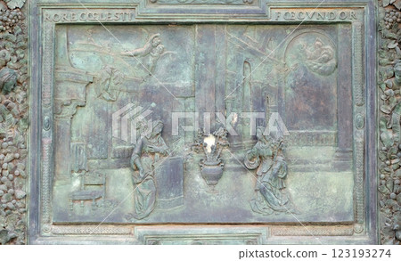 The Annunciation of the Virgin Mary, detail of the central door of the Cathedral St. Mary of the Assumption in Pisa, Italy 123193274