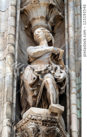 Statue of Saint on the facade of the Milan Cathedral, Duomo di Santa Maria Nascente, Milan, Lombardy, Italy 123193548