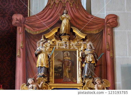Saint Verena surrounded by the statues of Saints, altar of Saint Maurice in the church of St. Leodegar in Lucerne, Switzerland Saint Verena surrounded by the statues of Saints, altar of Saint Maurice in the church of St. Leodegar in Lucerne, Switzerland 123193785