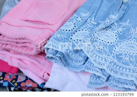 Baby blue vintage style embroidered dress and pink pants. Cleaning and recycling. Ecology and recycling. Baby blue vintage style embroidered dress and pink pants. Cleaning and recycling. Ecology and recycling. 123193799