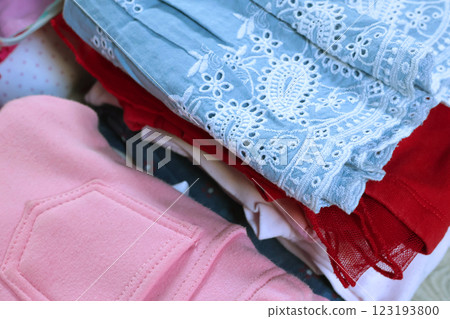 Baby blue vintage style embroidered dress and pink pants. Cleaning and recycling. Ecology and recycling. Baby blue vintage style embroidered dress and pink pants. Cleaning and recycling. Ecology and recycling. 123193800