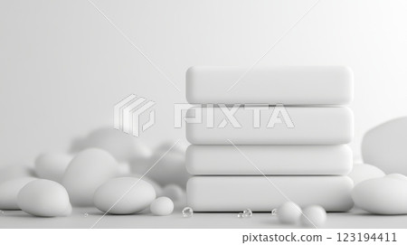 Elegant white blocks stacked gracefully among smooth pebbles Elegant white blocks stacked gracefully among smooth pebbles 123194411
