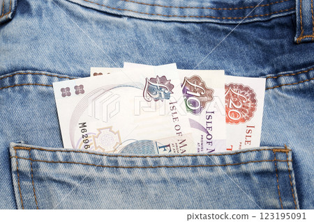 Manx pound in the pocket of blue jeans Manx pound in the pocket of blue jeans 123195091