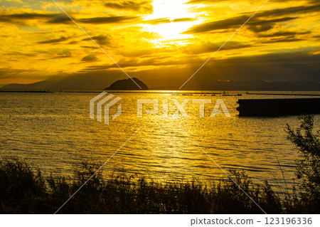 [Lake Biwa scenery] The fantastic Chikubu Island floating in the autumn evening scenery 123196336
