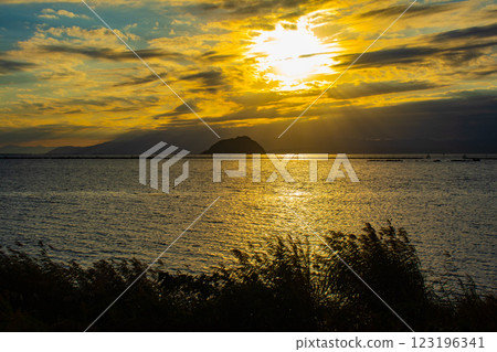 [Lake Biwa scenery] The fantastic Chikubu Island floating in the autumn evening scenery 123196341