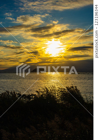 [Lake Biwa scenery] The fantastic Chikubu Island floating in the autumn evening scenery 123196344