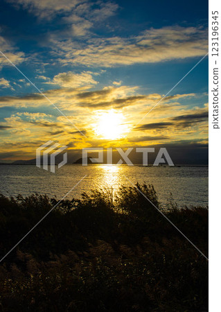 [Lake Biwa scenery] The fantastic Chikubu Island floating in the autumn evening scenery 123196345
