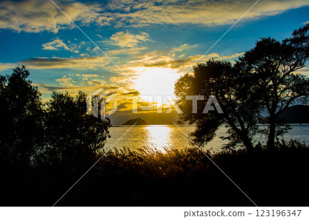 [Lake Biwa scenery] The fantastic Chikubu Island floating in the autumn evening scenery 123196347