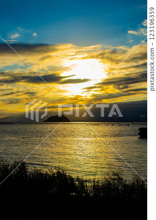 [Lake Biwa scenery] The fantastic Chikubu Island floating in the autumn evening scenery 123196359