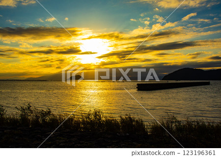 [Lake Biwa scenery] The fantastic Chikubu Island floating in the autumn evening scenery 123196361