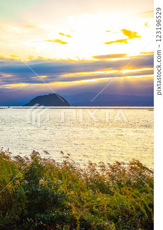 [Lake Biwa scenery] The fantastic Chikubu Island floating in the autumn evening scenery 123196529