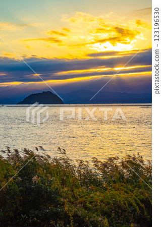 [Lake Biwa scenery] The fantastic Chikubu Island floating in the autumn evening scenery 123196530