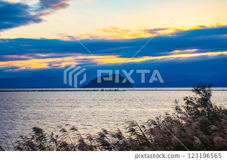 [Lake Biwa scenery] The fantastic Chikubu Island floating in the autumn evening scenery 123196565