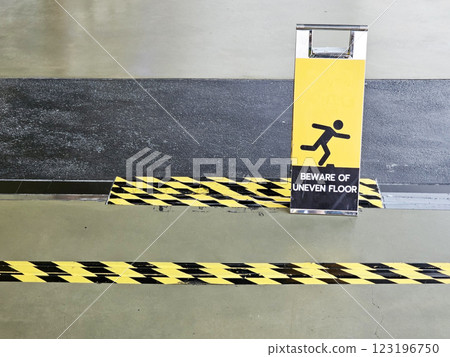 Beware of Uneven Floor Sign. 123196750