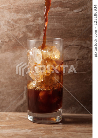 Black iced coffee on a ceramic table. 123196934