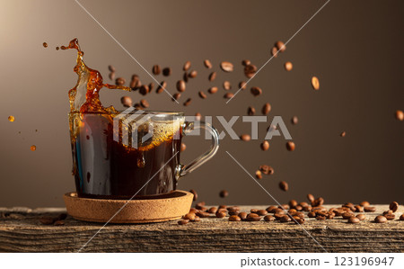 Black coffee in glass cup on an old wooden board. 123196947